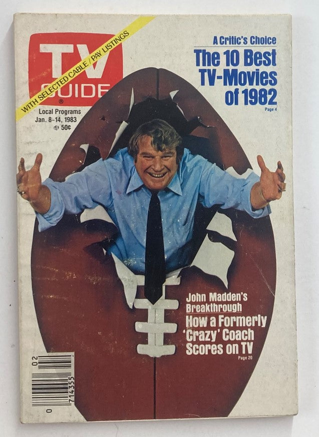 Cover of TV Guide Magazine January 8 1983 featuring John Madden, showcasing a humorous portrayal of Madden breaking through a football. The magazine highlights 'The 10 Best TV-Movies of 1982' and includes an article about Madden's breakthrough on television.