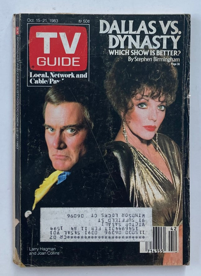 Front cover of TV Guide Magazine from October 21, 1983, featuring Larry Hagman and Joan Collins. The cover highlights a comparison of 'Dallas vs. Dynasty' and includes the title 'TV Guide', making it a collectible vintage magazine.