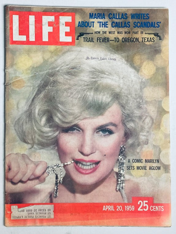 Cover of VTG Life Magazine April 20 1959 featuring Marilyn Monroe, showcasing her iconic hairstyle and glamorous persona, with a headline that reads 'A Comic Marilyn Sets Movie Aglow'.