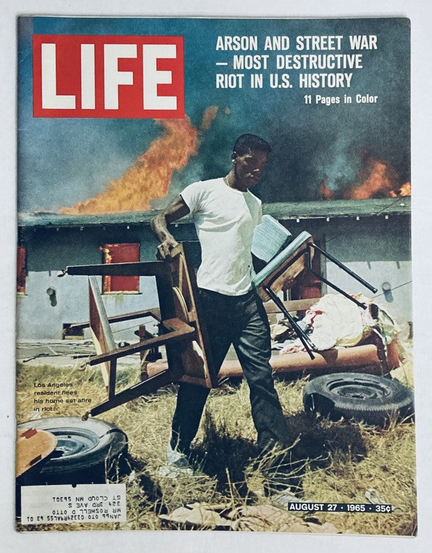 Cover of VTG Life Magazine August 27, 1965 featuring the title 'Arson and Street War - Most Destructive Riot in U.S. History' with a visual depiction of a man carrying furniture amid a fire, highlighting historical race riots in the U.S.