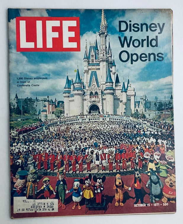 Life Magazine October 15 1971 cover featuring Disney World Cinderella Castle with a crowd of Disney employees, showcasing the grand opening of the iconic landmark.