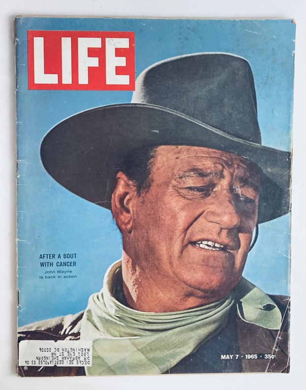 Cover of VTG Life Magazine May 7, 1965 featuring John Wayne after a bout with cancer, showcasing his rugged persona and resilience.