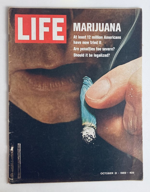 Cover of VTG Life Magazine October 31 1969 featuring a close-up image of a hand holding a marijuana cigarette, with a bold title on the magazine discussing marijuana legalization.