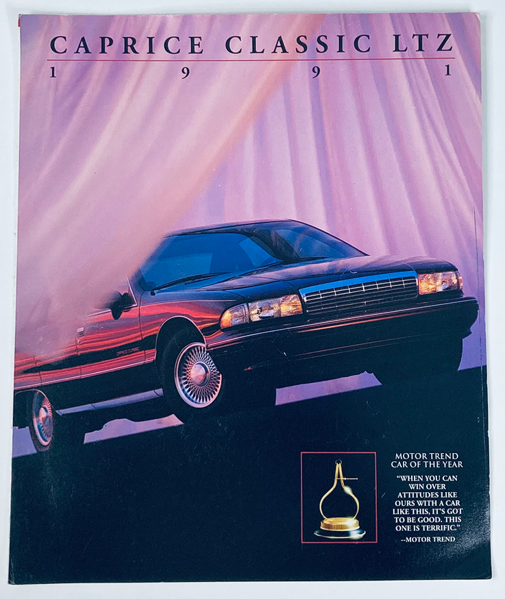 1991 Chevrolet Caprice Classic Ltz Dealer Showroom Sales Brochure Cover featuring the car with a sleek design, emphasizing its recognition as Motor Trend Car of the Year.