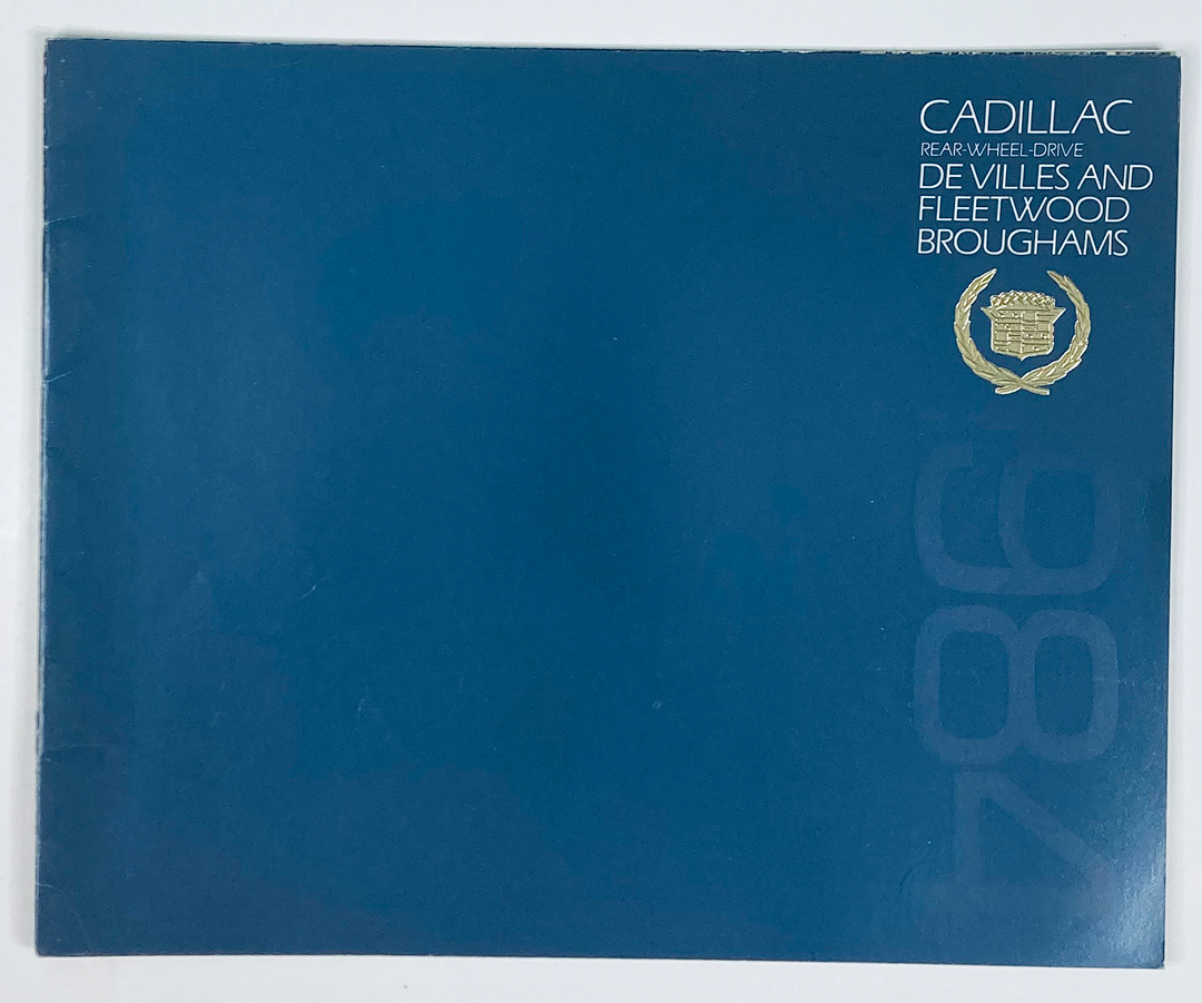 Cover of the 1984 Cadillac DeVilles & Fleetwood Dealer Showroom Sales Brochure Guide Catalog, featuring a minimalist design with Cadillac logo and bold text.