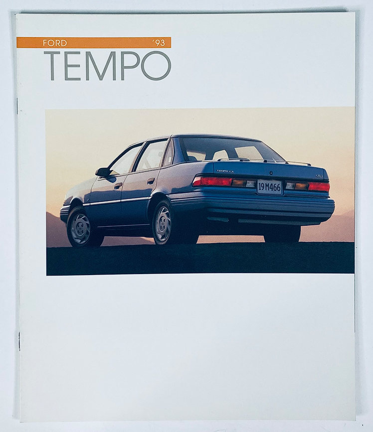 1993 Ford Tempo Dealer Showroom Sales Brochure Guide Catalog showcasing the rear view of a blue Ford Tempo parked against a scenic backdrop.