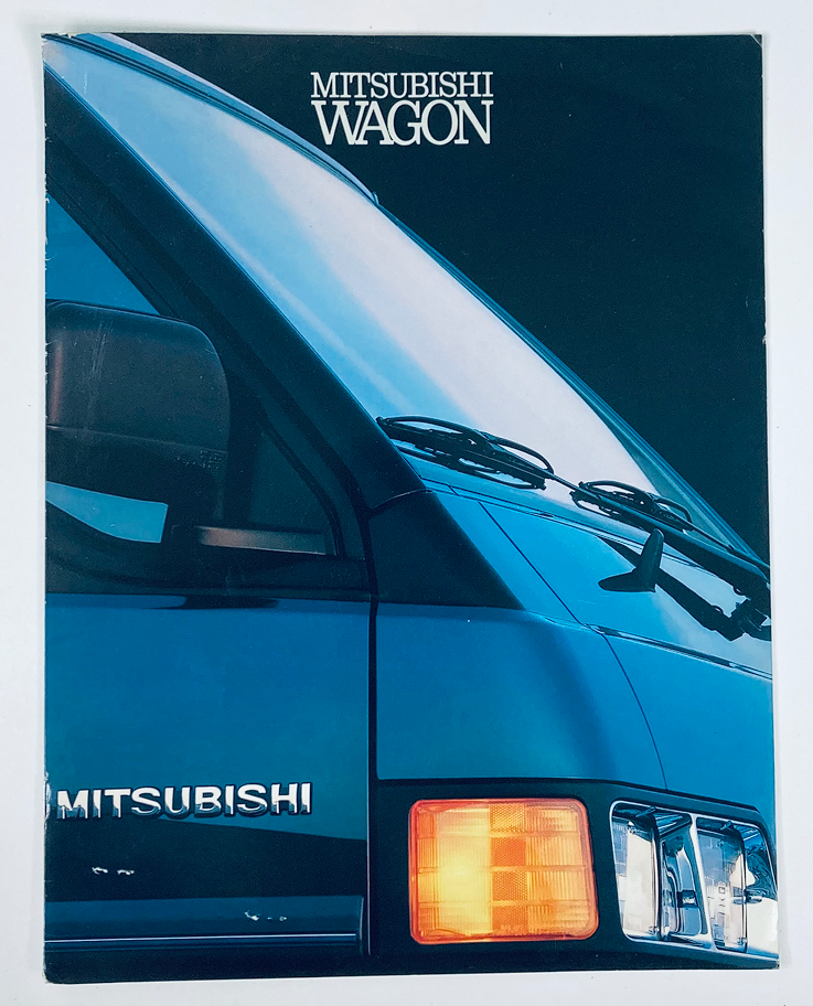 1990 Mitsubishi Wagon Dealer Showroom Sales Brochure featuring a close-up of the rear view of a Mitsubishi Wagon, highlighting its design and features, perfect for collectors and enthusiasts.