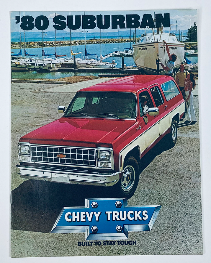 1980 Chevrolet Suburban Dealer Showroom Sales Brochure featuring a red and white Chevy Suburban parked near a marina with boats in the background, emphasizing Chevrolet trucks with the tagline 'BUILT TO STAY TOUGH'.