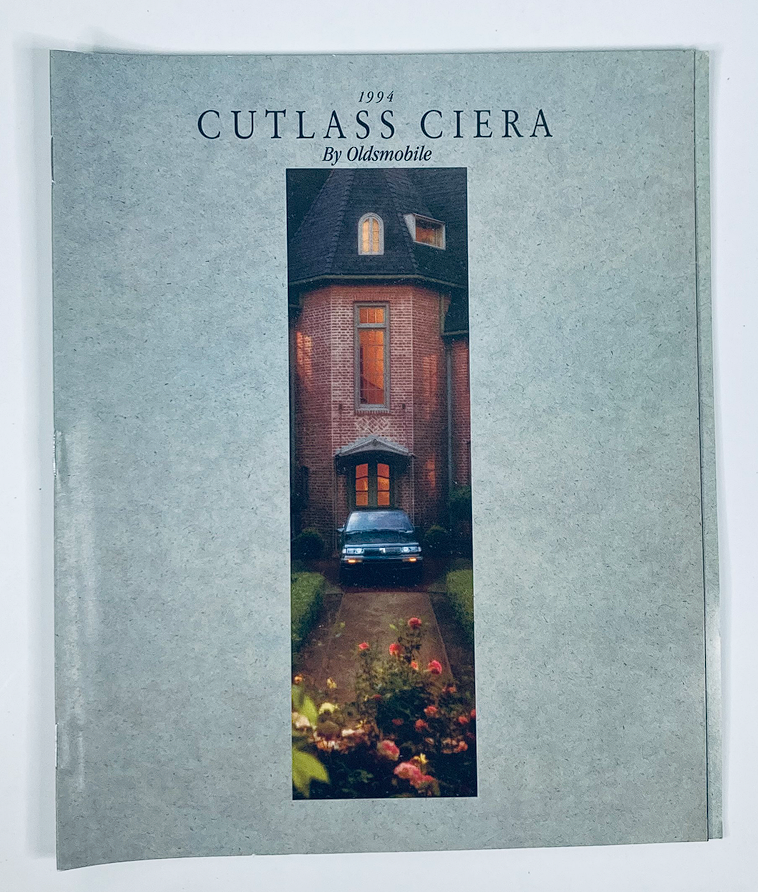 1994 Oldsmobile Cutlass Ciera Dealer Showroom Sales Brochure Guide Catalog featuring a scenic view of a home with a Cutlass Ciera parked in the driveway.