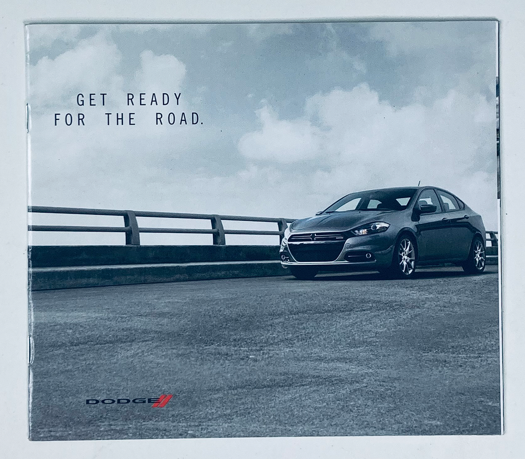 2000s Dodge Dealer Showroom Sales Brochure Guide Catalog featuring a sleek Dodge vehicle on a road with a cloudy sky, highlighting the message 'Get Ready for the Road'.