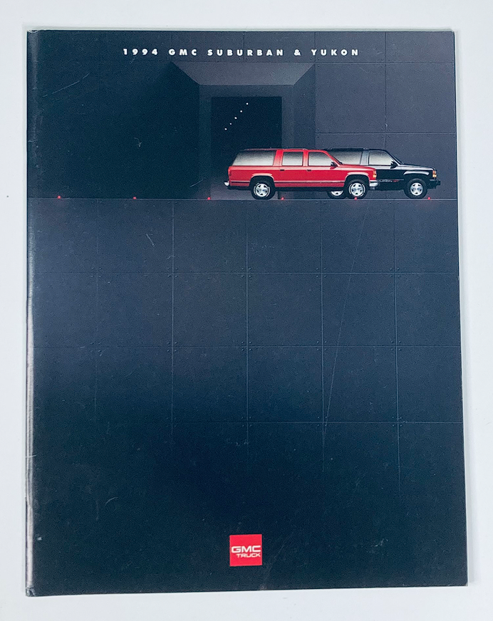 1994 GMC Suburban & Yukon Dealer Showroom Sales Brochure, featuring a sleek black and red design with the vehicles prominently displayed.