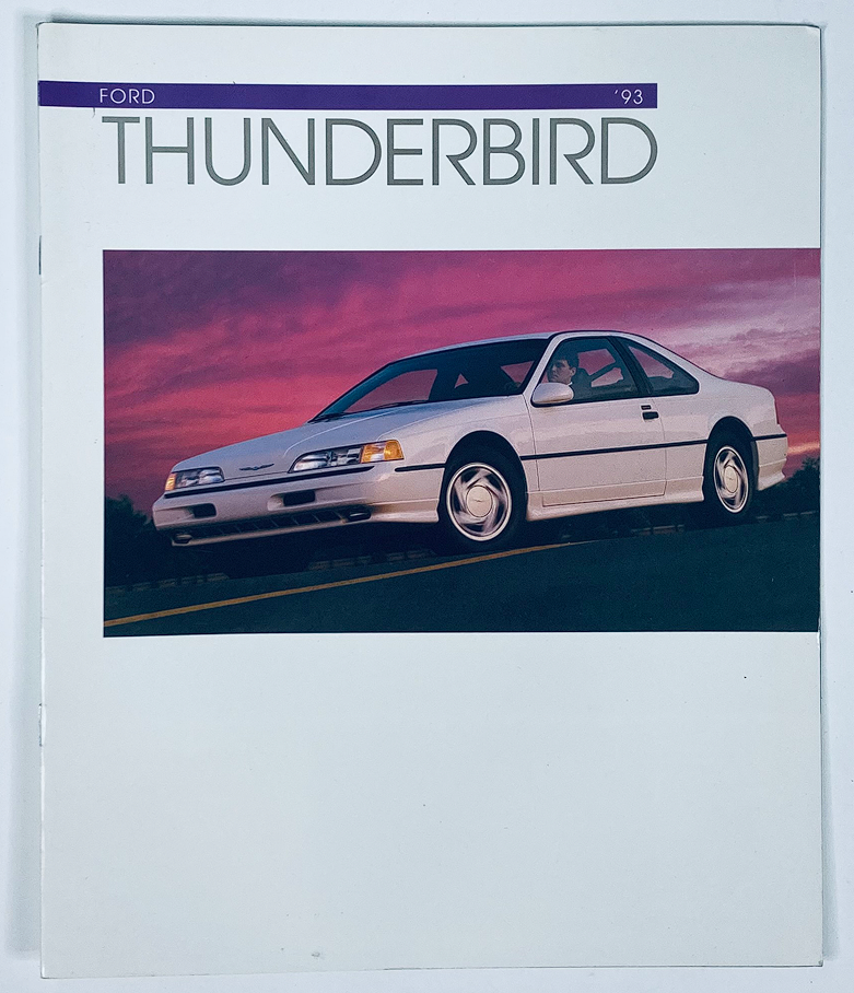 1993 Ford Thunderbird Dealer Showroom Sales Brochure Guide Catalog featuring a stylish white Ford Thunderbird on a scenic background.