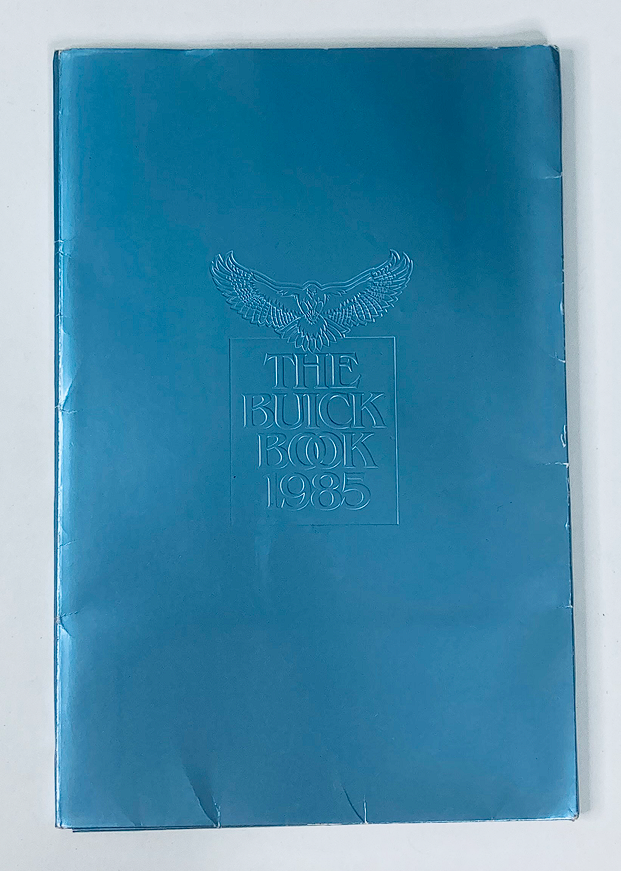 1985 Buick Dealer Showroom Sales Brochure Guide Catalog featuring a vibrant blue cover with embossed title and eagle design.