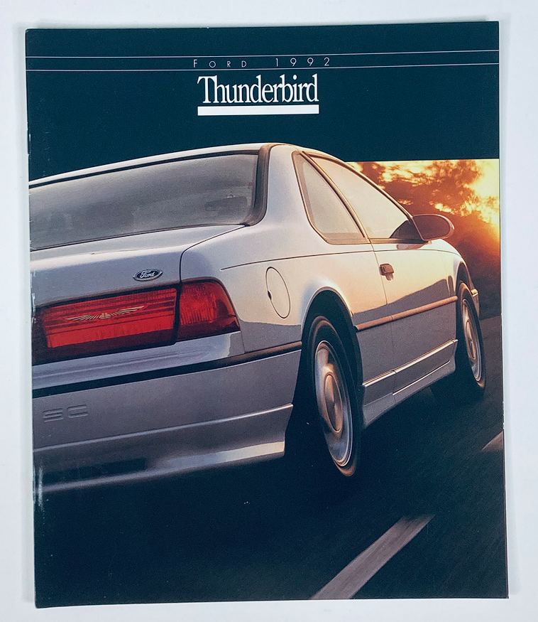 Cover of the 1992 Ford Thunderbird Dealer Showroom Sales Brochure, showcasing the sleek design of the Ford Thunderbird against a sunset backdrop.