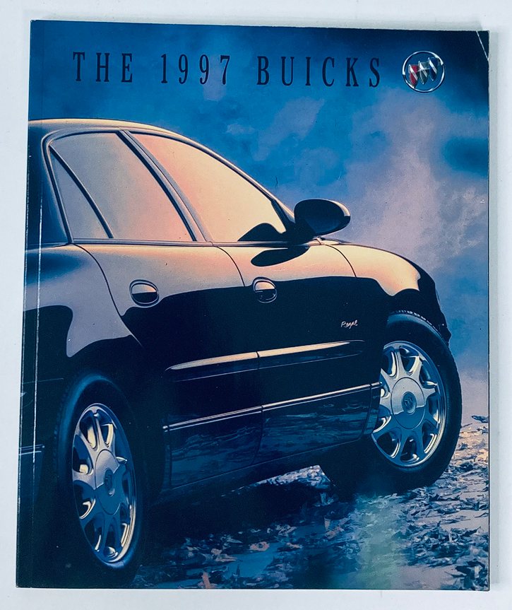 Cover of the 1997 Buick Dealer Showroom Sales Brochure Guide Catalog featuring a sleek black Buick car against a dramatic sky background.