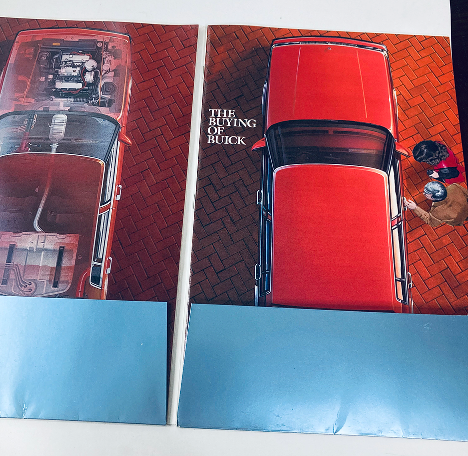 Cover of the 1985 Buick Dealer Showroom Sales Brochure Guide Catalog titled 'The Buying of Buick' featuring an overhead image of a red Buick model with a customer reviewing the vehicle.