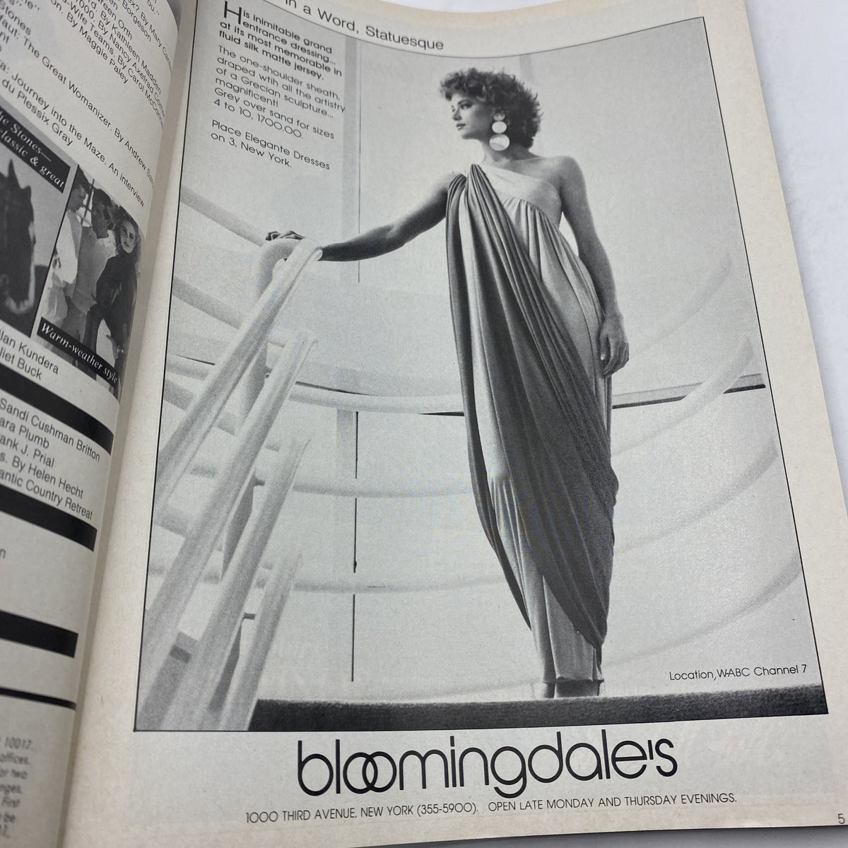 VTG Vogue Magazine February 1982 Mariel Hemingway by Bill King - Black and white fashion advertisement featuring a model in a statue-like pose wearing an elegant draped gown, highlighting vintage style.