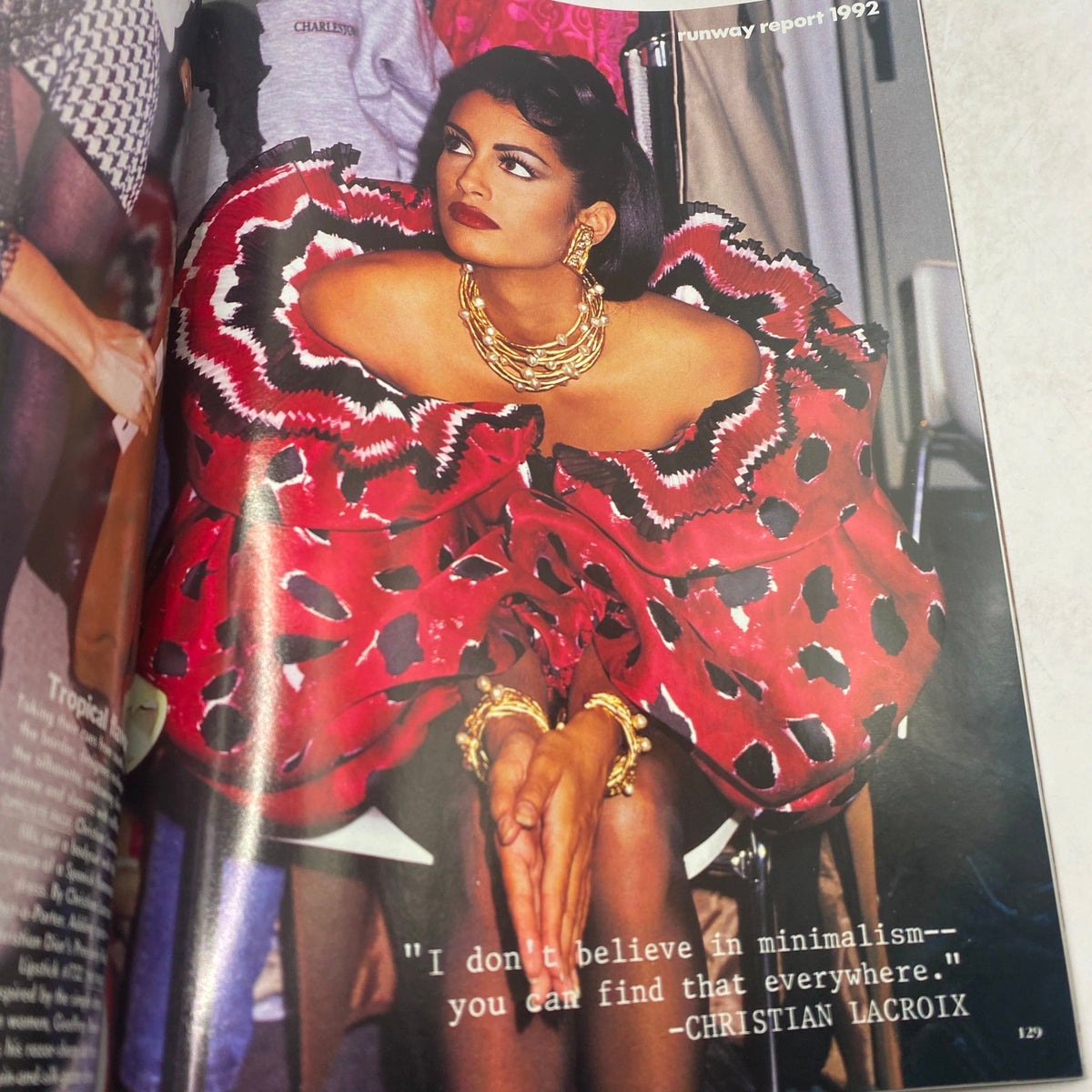 Runway report section in Vogue Magazine January 1992 featuring a model in a vibrant, dramatic red outfit by designer Christian Lacroix, highlighted with a quote about fashion.