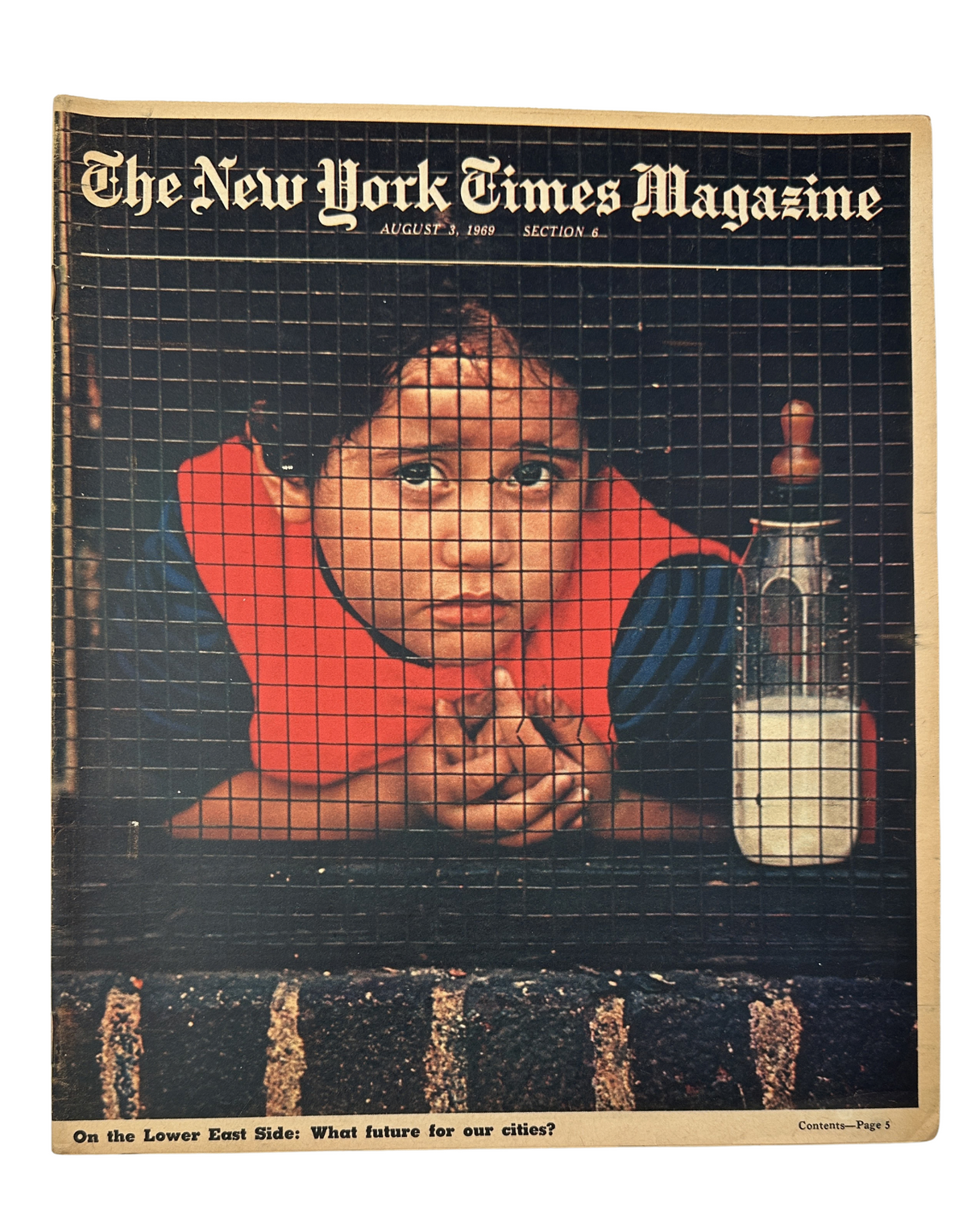 Cover of The New York Times Magazine, August 3, 1969, featuring a child looking out from behind a safety screen, symbolizing themes of urban crisis in the Lower East Side.