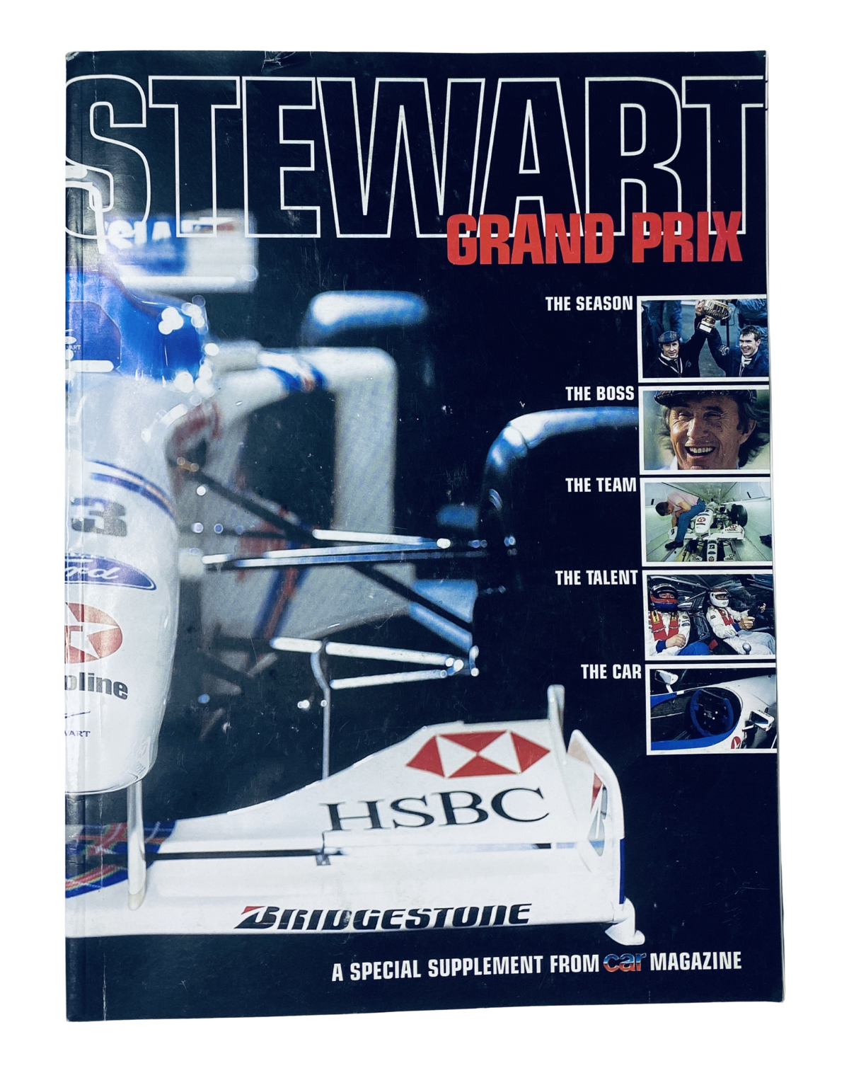 Cover of CAR Magazine Stewart Grand Prix Supplement 1999 featuring Jackie Stewart and Rubens Barrichello, showcasing F1 imagery and branding.