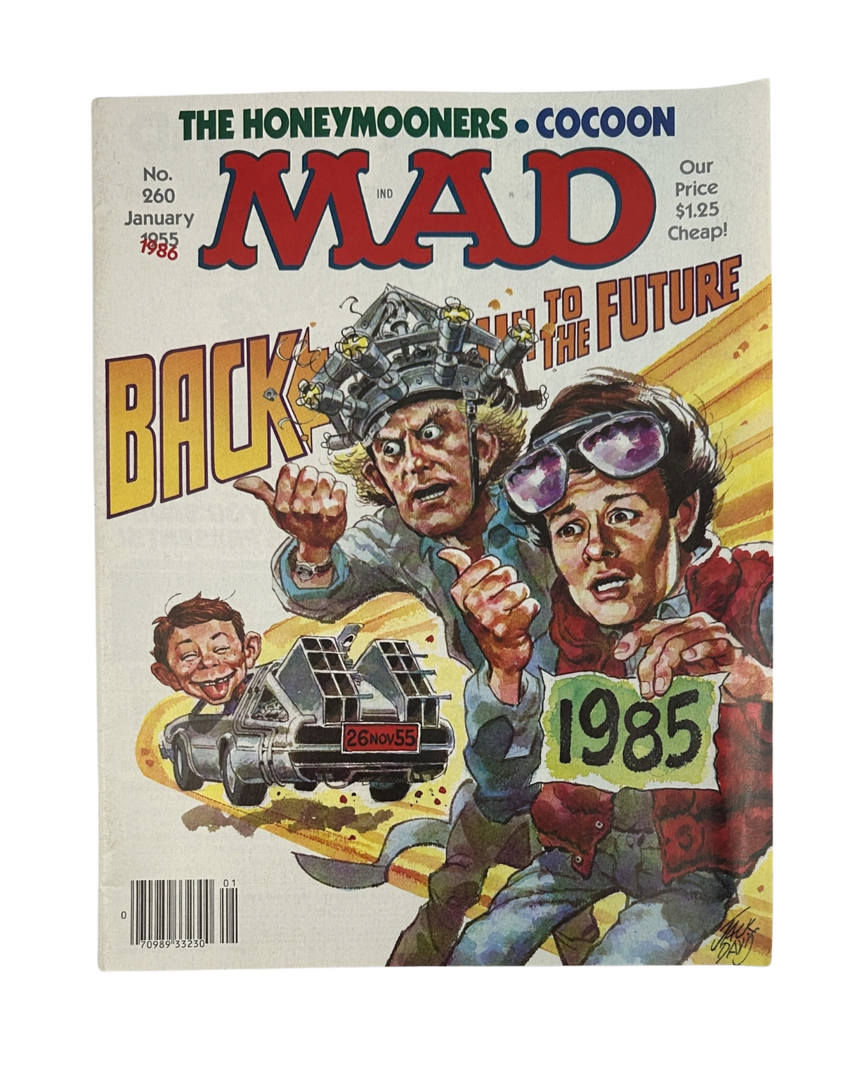 Cover of MAD Magazine No. 260 from January 1986 featuring a humorous illustration related to 'Back to the Future,' alongside characters from 'Cocoon' and 'The Honeymooners.'