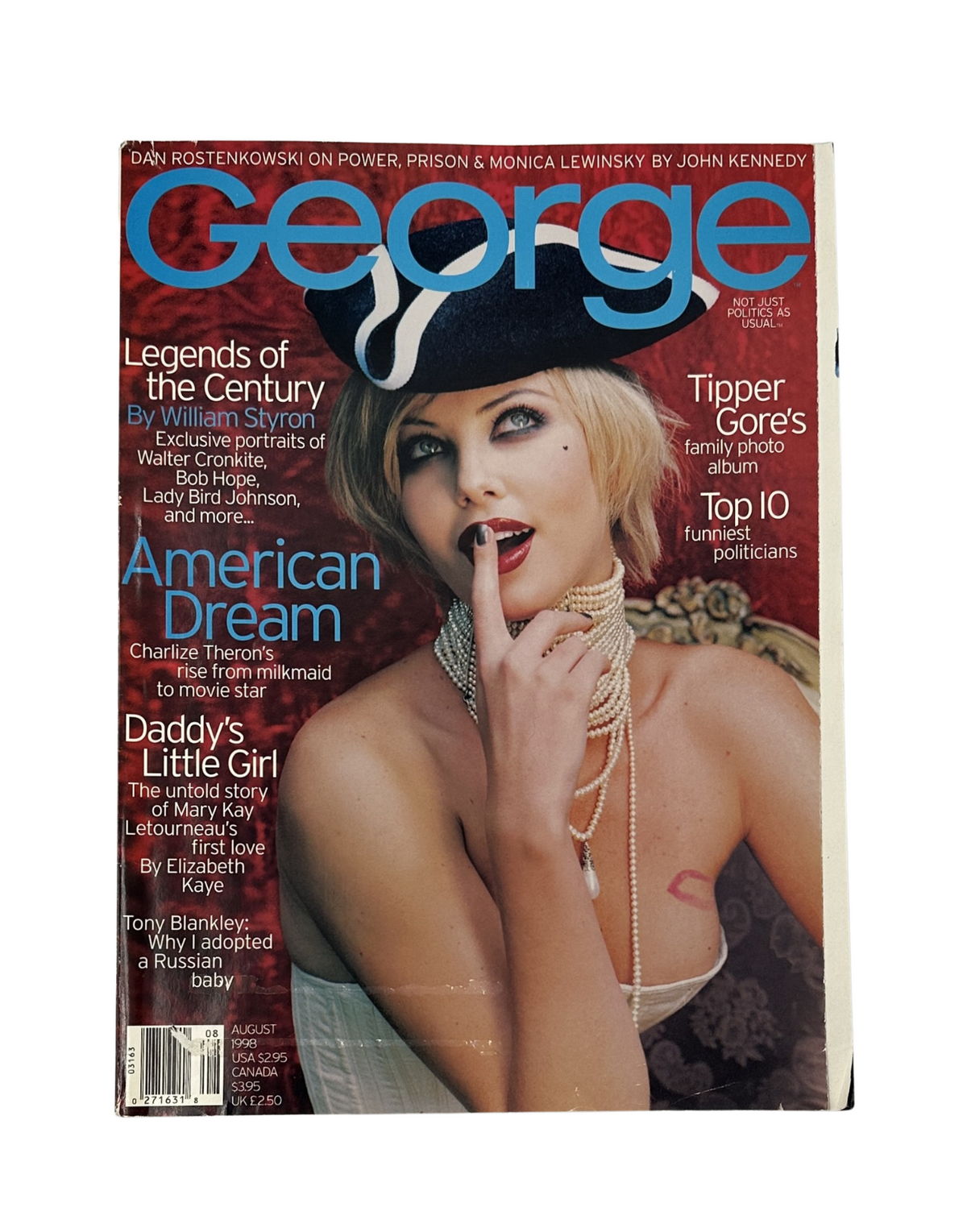 George Magazine August 1998 cover featuring Charlize Theron in a stylish hat and pearl accessories, highlighted with articles on Tipper Gore and American Dreamers.