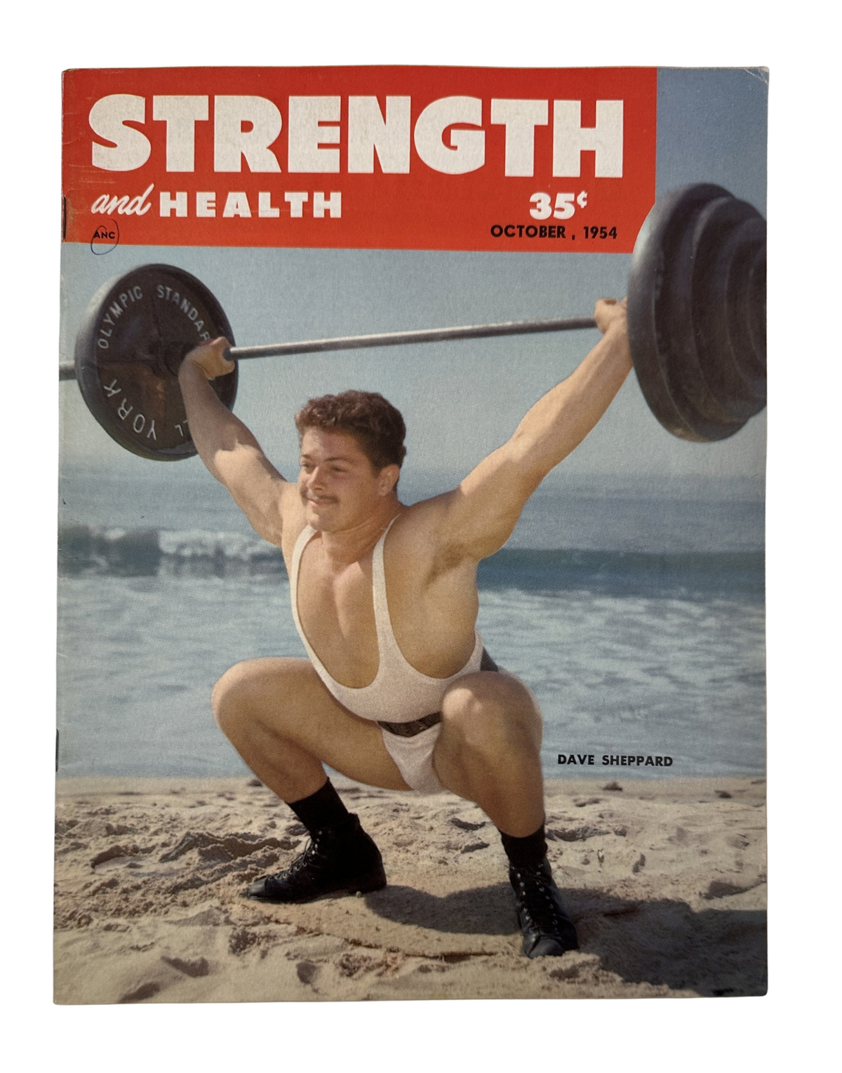 Strength and Health Magazine, October 1954 cover featuring Dave Sheppard performing a weightlifting squat on the beach.