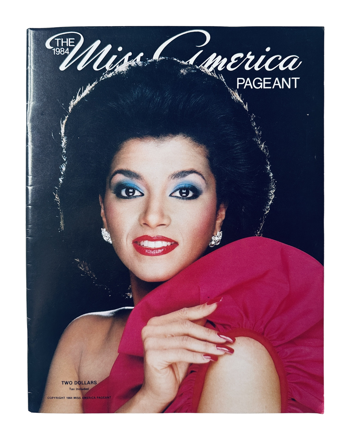 The 1984 Miss America Pageant Magazine Official Program featuring Suzette Charles on the cover, showcasing her glamorous look with bold makeup and a pink ruffled dress.