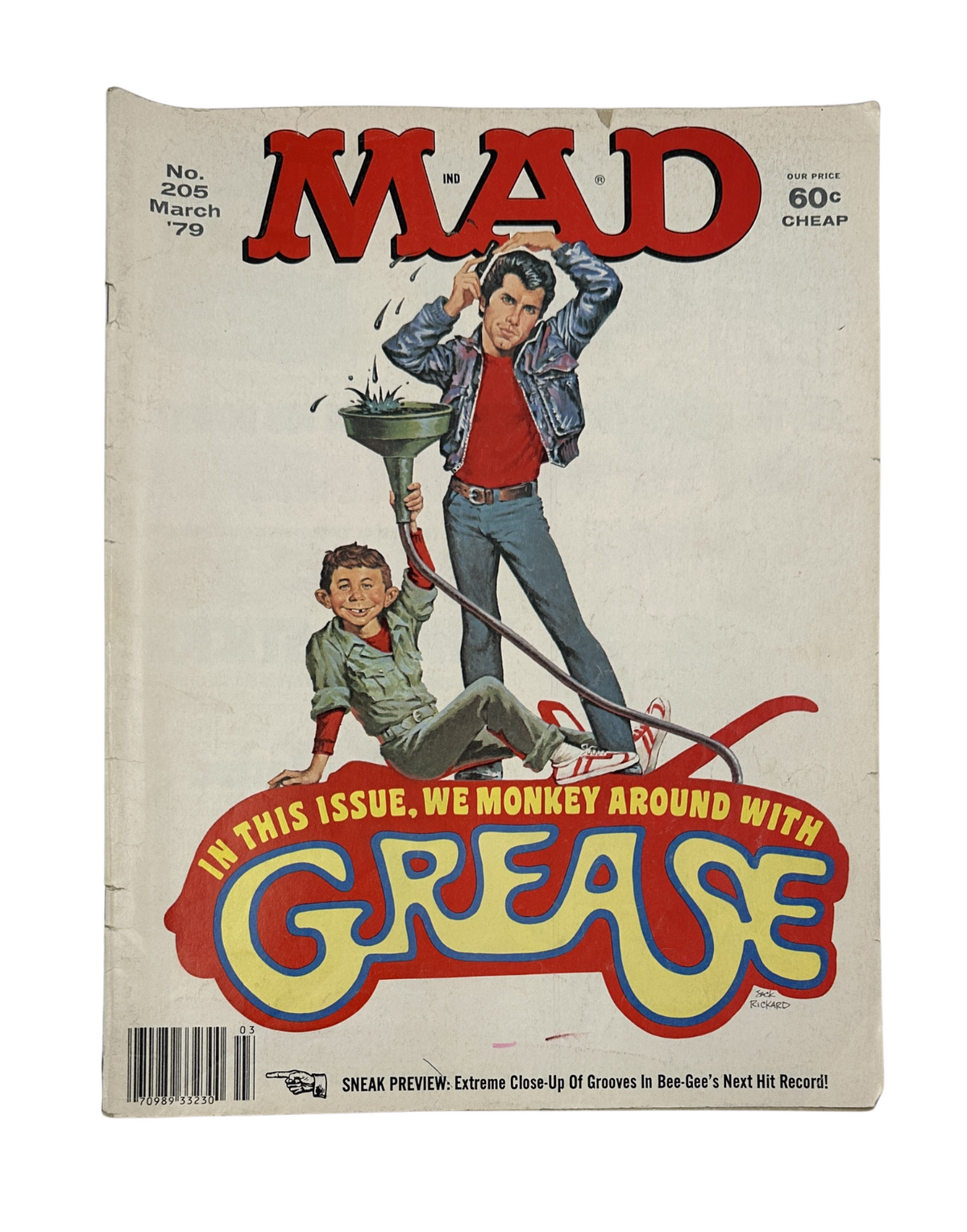 MAD Magazine No. 205 from March 1979 featuring a Grease parody on the cover, showcasing humor and satire related to the movie, with colorful artwork.
