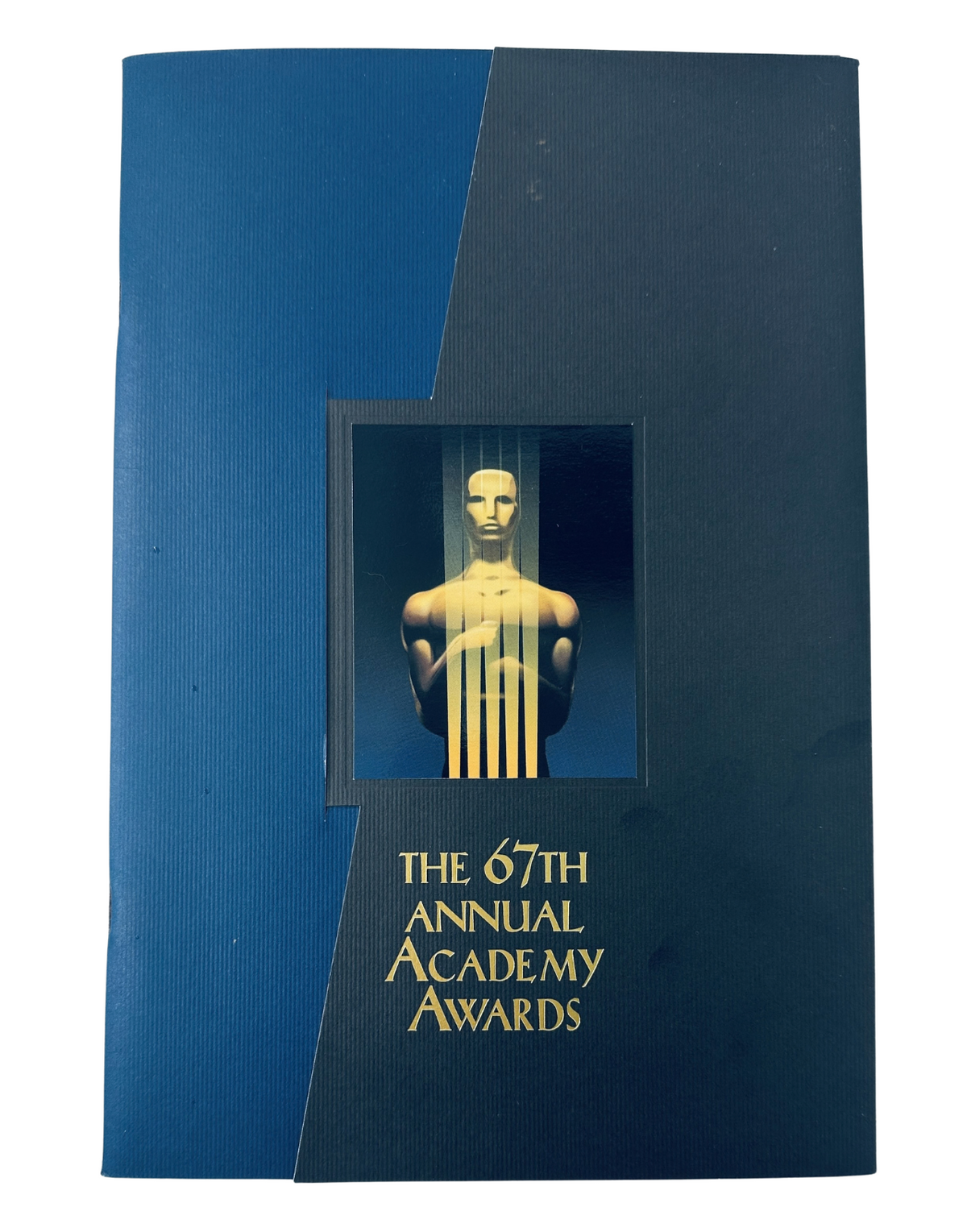 Cover of the 67th Annual Academy Awards Magazine Program, featuring an artistic representation of an Oscar statue and the title 'The 67th Annual Academy Awards'.