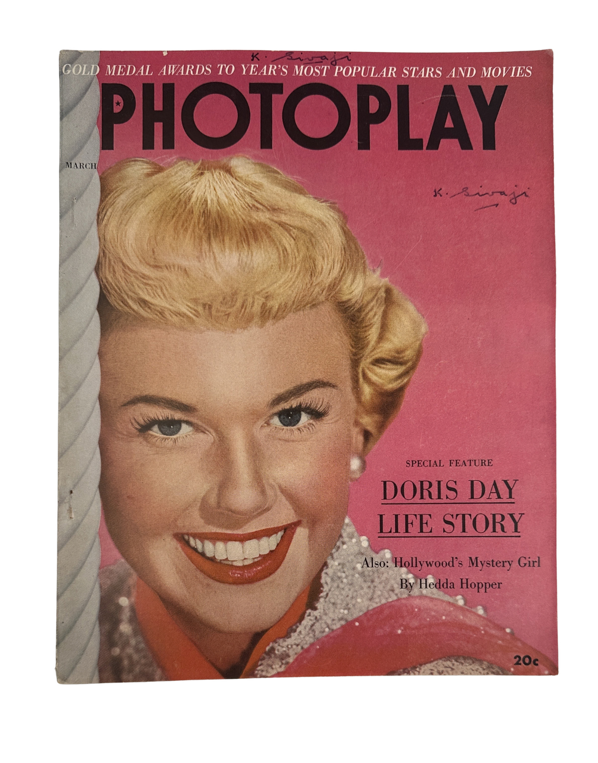Cover of Photoplay Magazine March 1952 featuring Doris Day with a bright smile, highlighting the special feature 'Doris Day Life Story' along with the text 'Hollywood's Mystery Girl' by Hedda Hopper.