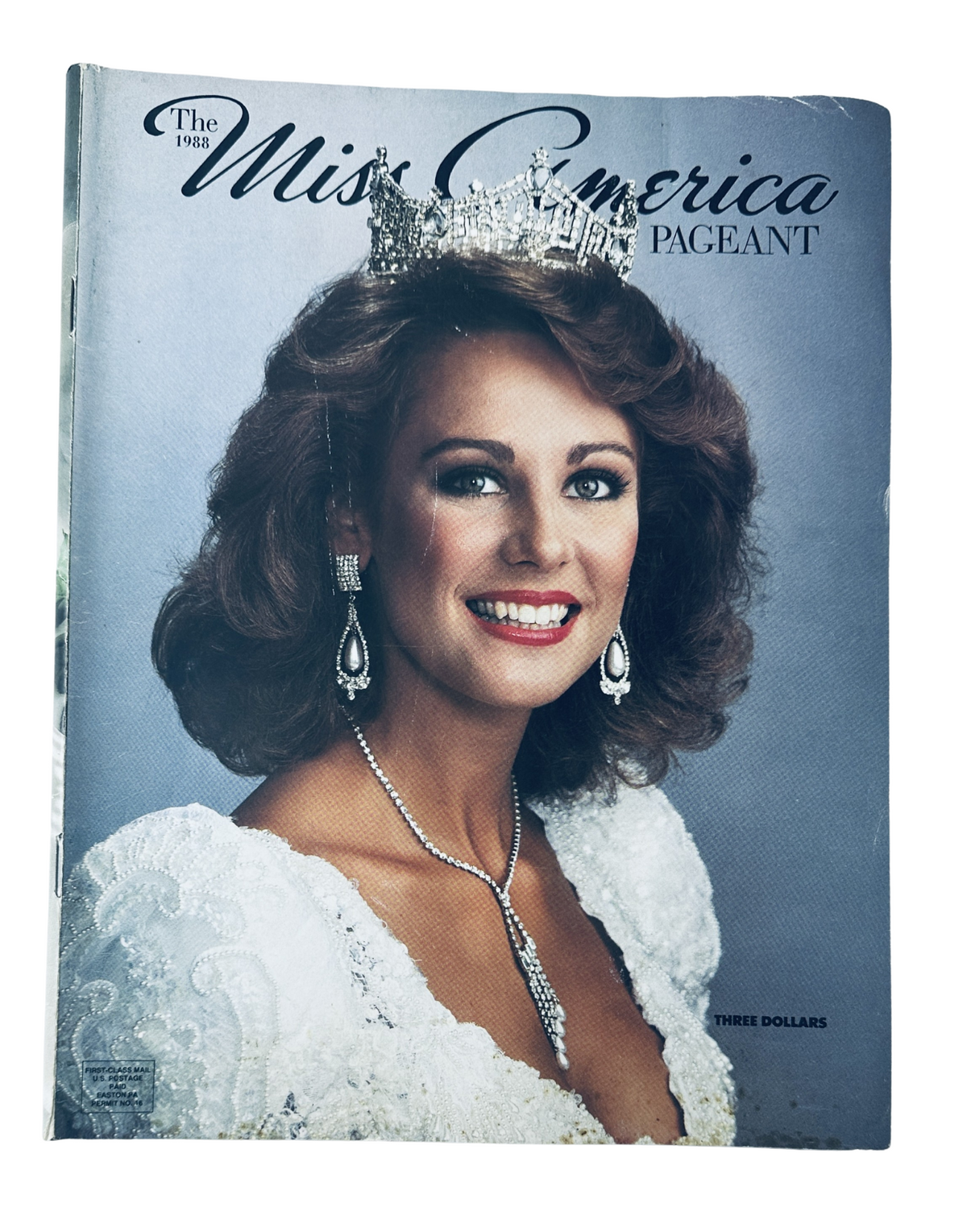 Cover of 'The 1988 Miss America Pageant Magazine Program' featuring Kaye Lani Rae Rafko, showcasing her wearing a crown, surrounded by elegant attire and jewelry.