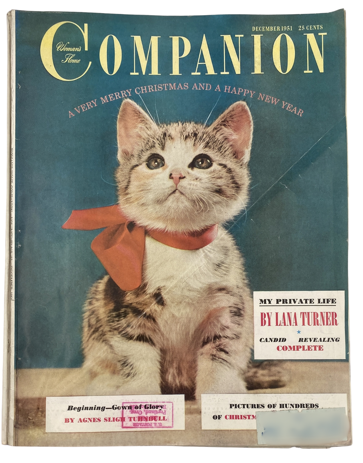 Woman’s Home Companion Magazine December 1951 featuring a kitten on the cover, celebrating Christmas with a festive bow, and highlighting an article by Lana Turner.