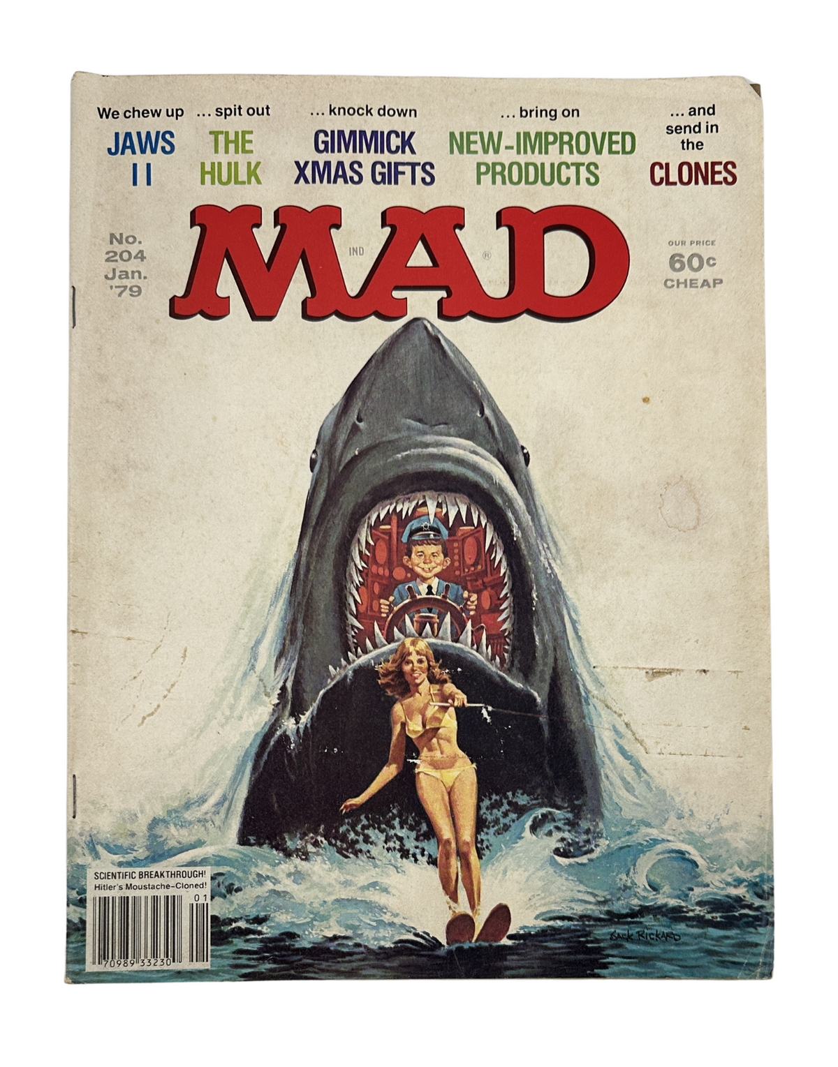 Cover of MAD Magazine No. 204 from January 1979 featuring Jaws II and movie parodies with artwork including a shark and a woman in a swimsuit. This issue is graded Very Good (VG 4.0).