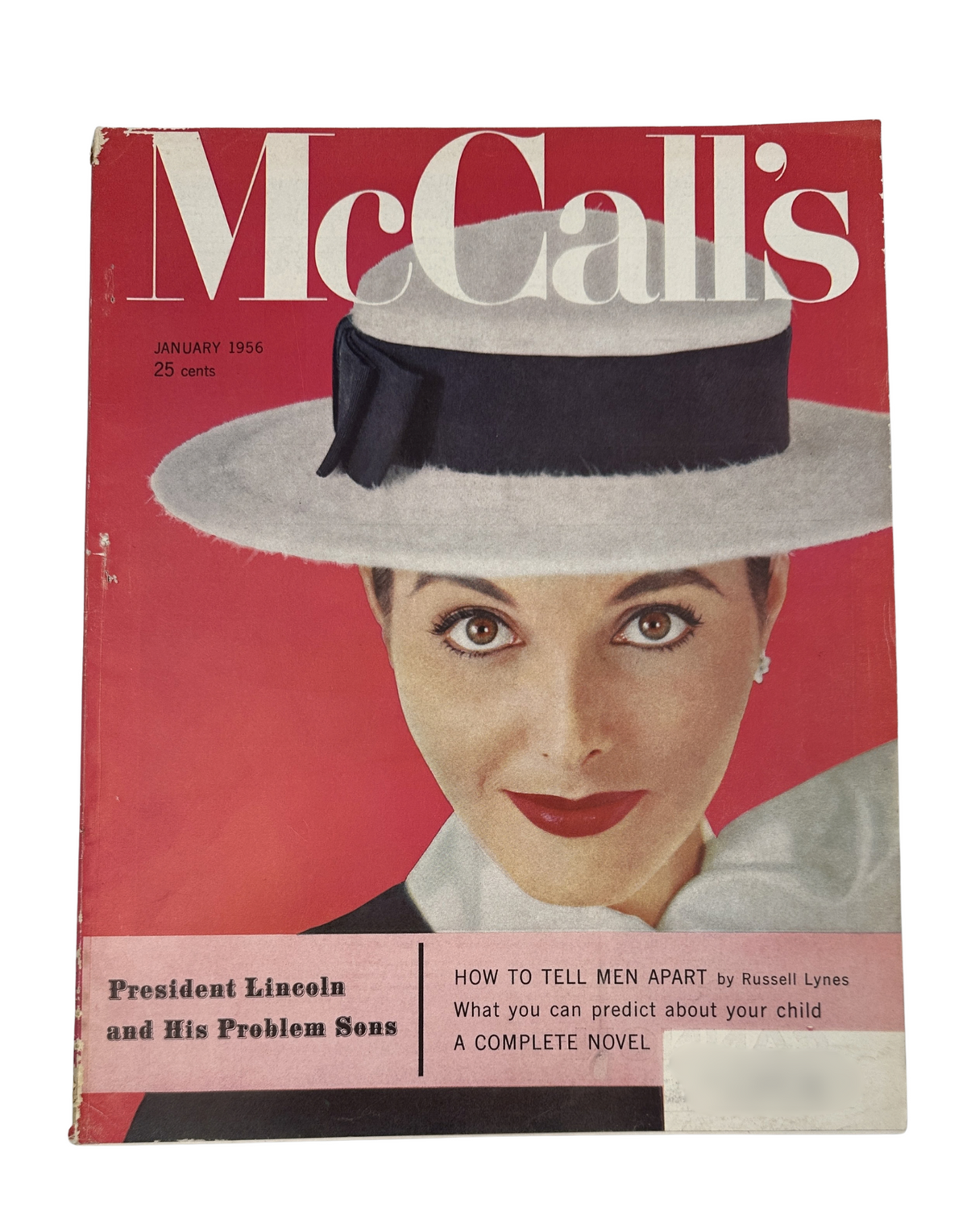 McCall’s Magazine January 1956 cover featuring a woman wearing a stylish hat, highlighting the feature 'President Lincoln and His Problem Sons' and the article 'How to Tell Men Apart' by Russell Lynes.