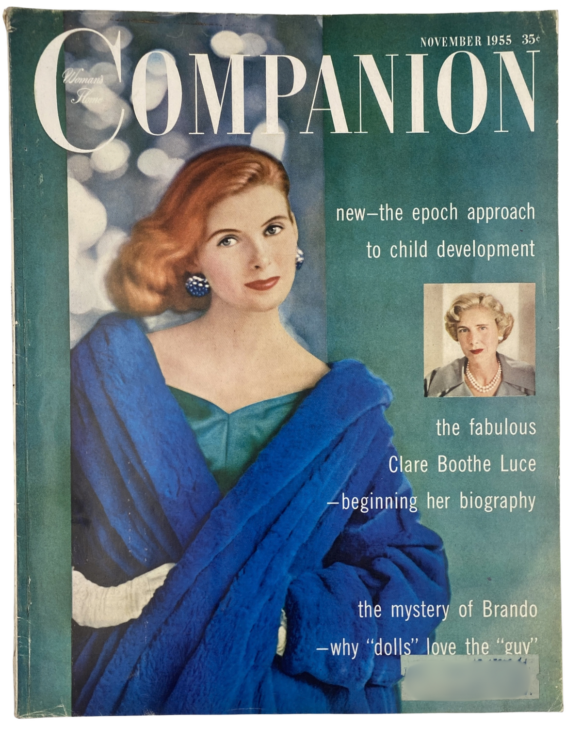 Cover of Woman’s Home Companion Magazine, November 1955 featuring Clare Boothe Luce, showcasing a glamorous woman in a blue fur coat, with text highlighting articles on child development and Brando.