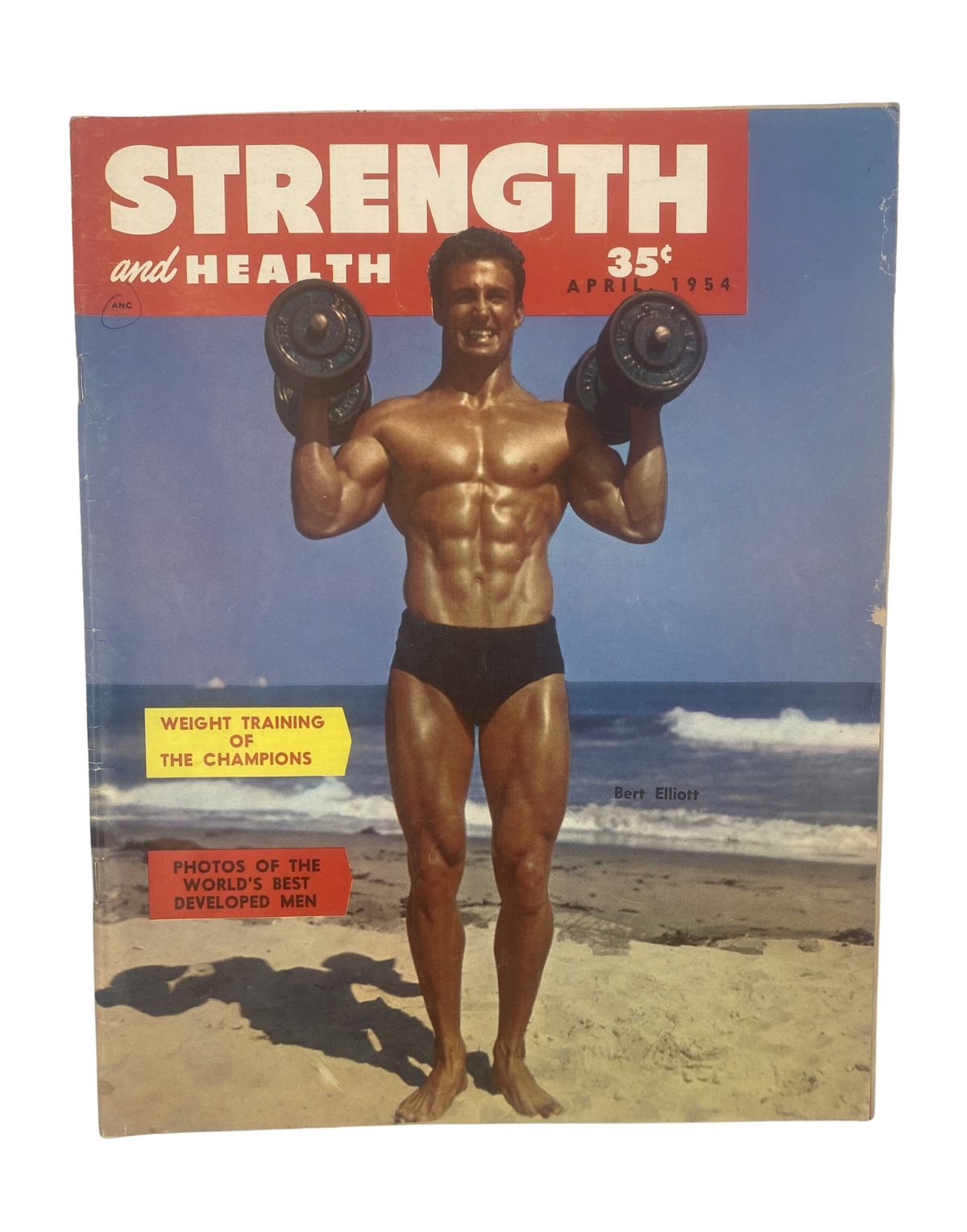 Cover of Strength and Health Magazine, April 1954 featuring Bert Elliott showcasing weight training, with a beach background and bold text highlighting 'Weight Training of the Champions'.