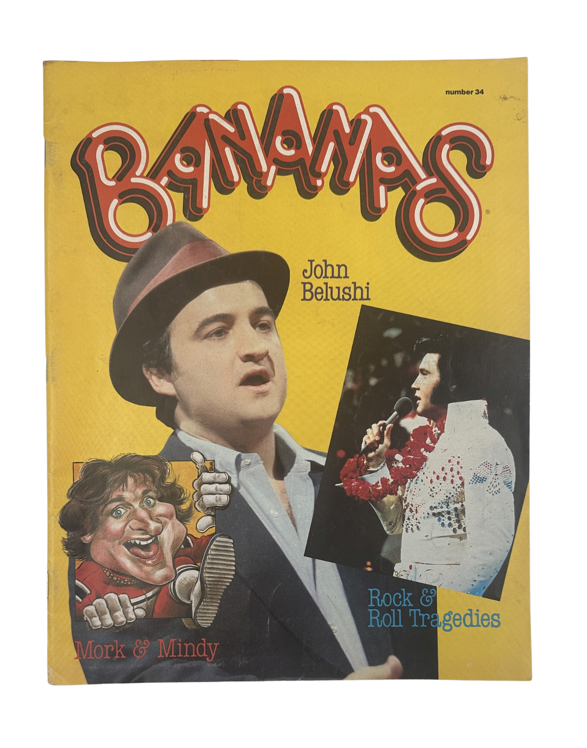 Cover of Bananas Magazine No. 34 featuring John Belushi and a parody of Mork & Mindy, highlighting Rock & Roll Tragedies in a vibrant design.