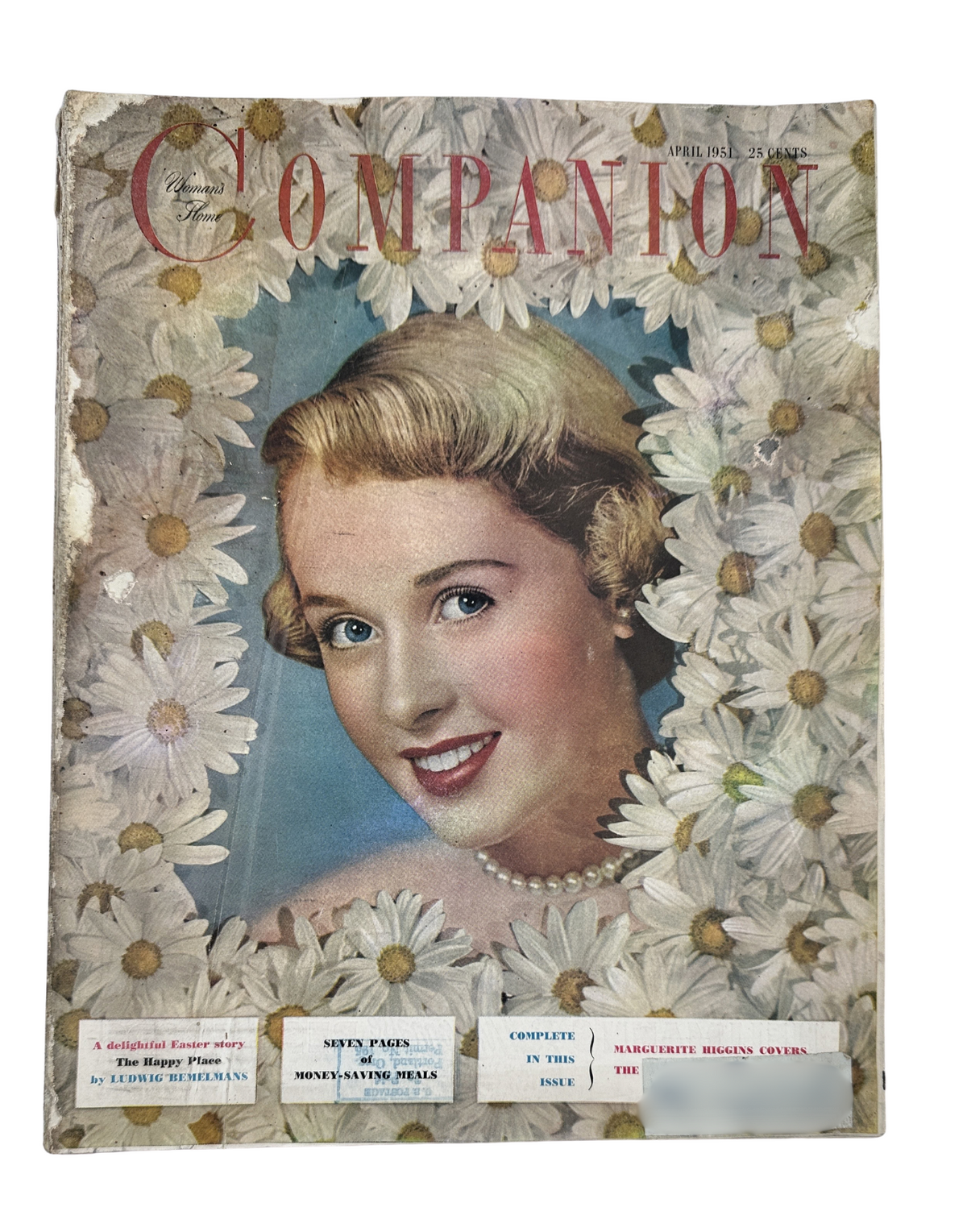 Cover of Woman’s Home Companion Magazine April 1951 featuring a beautiful woman surrounded by daisies, emphasizing Marguerite Higgins' article about the War in Korea.