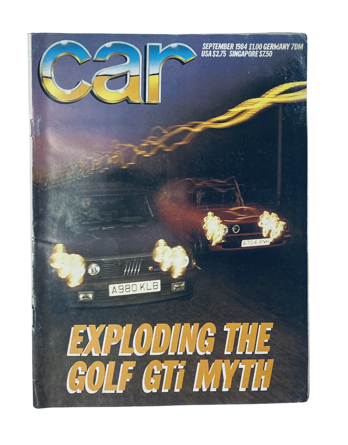 Cover of Car Magazine September 1984 featuring the headline 'Exploding the Golf GTI Myth' alongside images of the Volkswagen Golf GTI and Fiat Abarth 130TC.