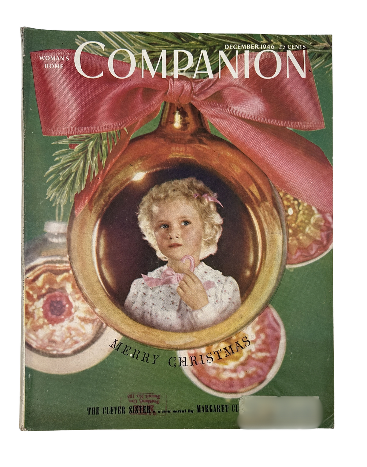 Cover of Woman’s Home Companion Magazine December 1946 featuring a young girl inside a Christmas ornament, with the title 'Merry Christmas' and highlights of short stories and articles including 'The Clever Sister'.