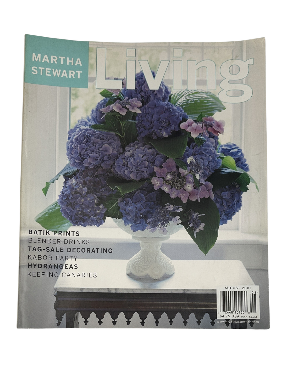 Cover of Martha Stewart Living Magazine August 2001, featuring a vibrant arrangement of hydrangeas and a title emphasizing Batik Prints, Blender Drinks, Tag-Sale Decorating, and other engaging topics.