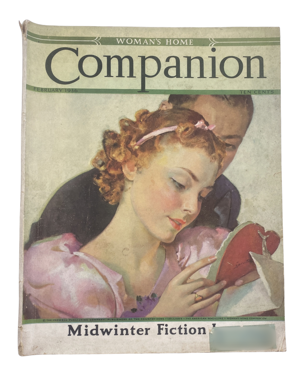 Cover of Woman’s Home Companion Magazine February 1936 featuring midwinter fiction theme, showcasing a woman reading the magazine with a romantic background.