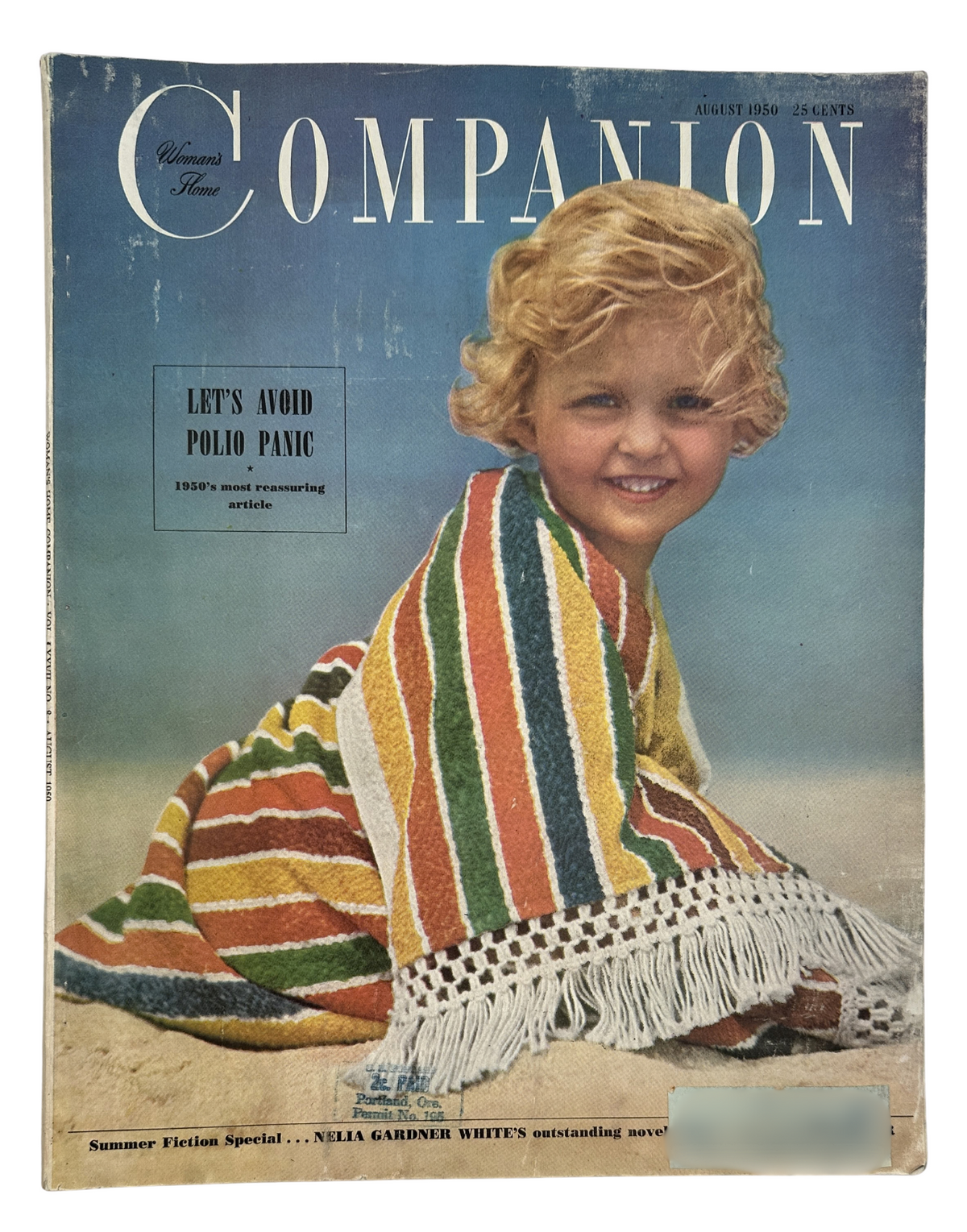 Cover of Woman’s Home Companion Magazine August 1950 featuring a young girl with curly blonde hair sitting on the beach, draped in a colorful striped blanket, with the headline 'Let’s Avoid Polio Panic' highlighting the magazine's focus on health and safety concerns during that era.