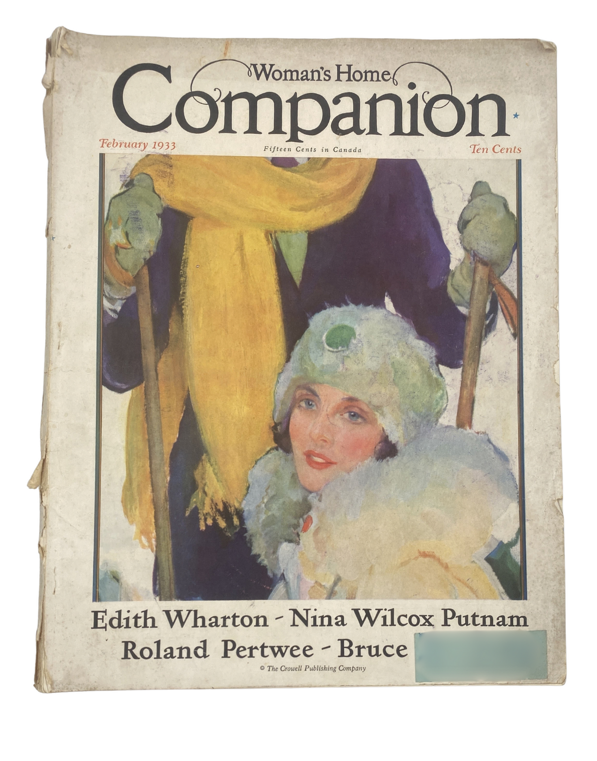Cover image of Woman’s Home Companion Magazine February 1933 featuring artwork by Edith Wharton and Nina Wilcox Putnam, showcasing a woman in winter attire.