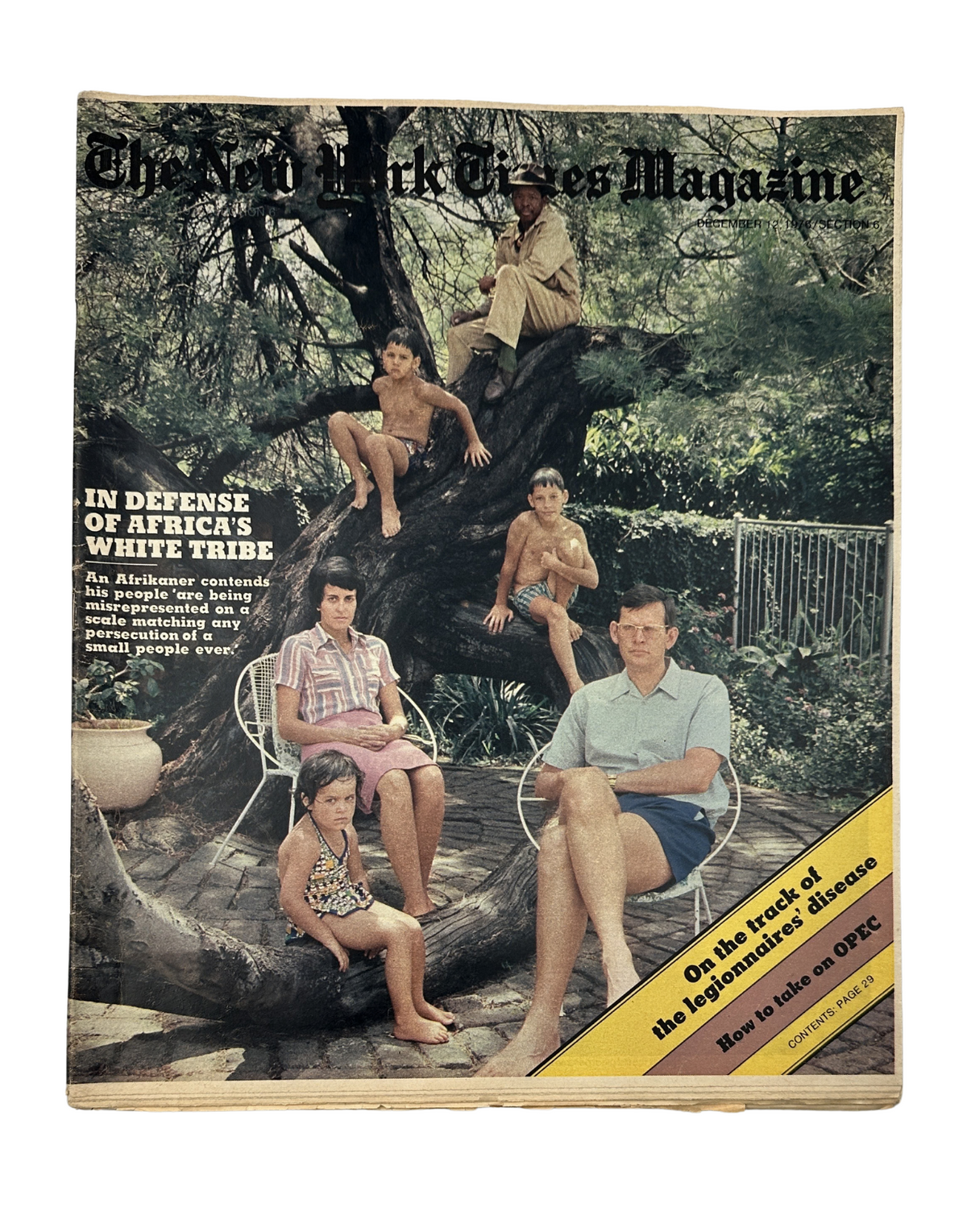 The New York Times Magazine December 12, 1976 cover featuring a family of Afrikaners relaxing on a tree. The headline reads 'In Defense of Africa's White Tribe' with a subheading about the response to OPEC. This iconic cover highlights the cultural themes and social issues of the time.