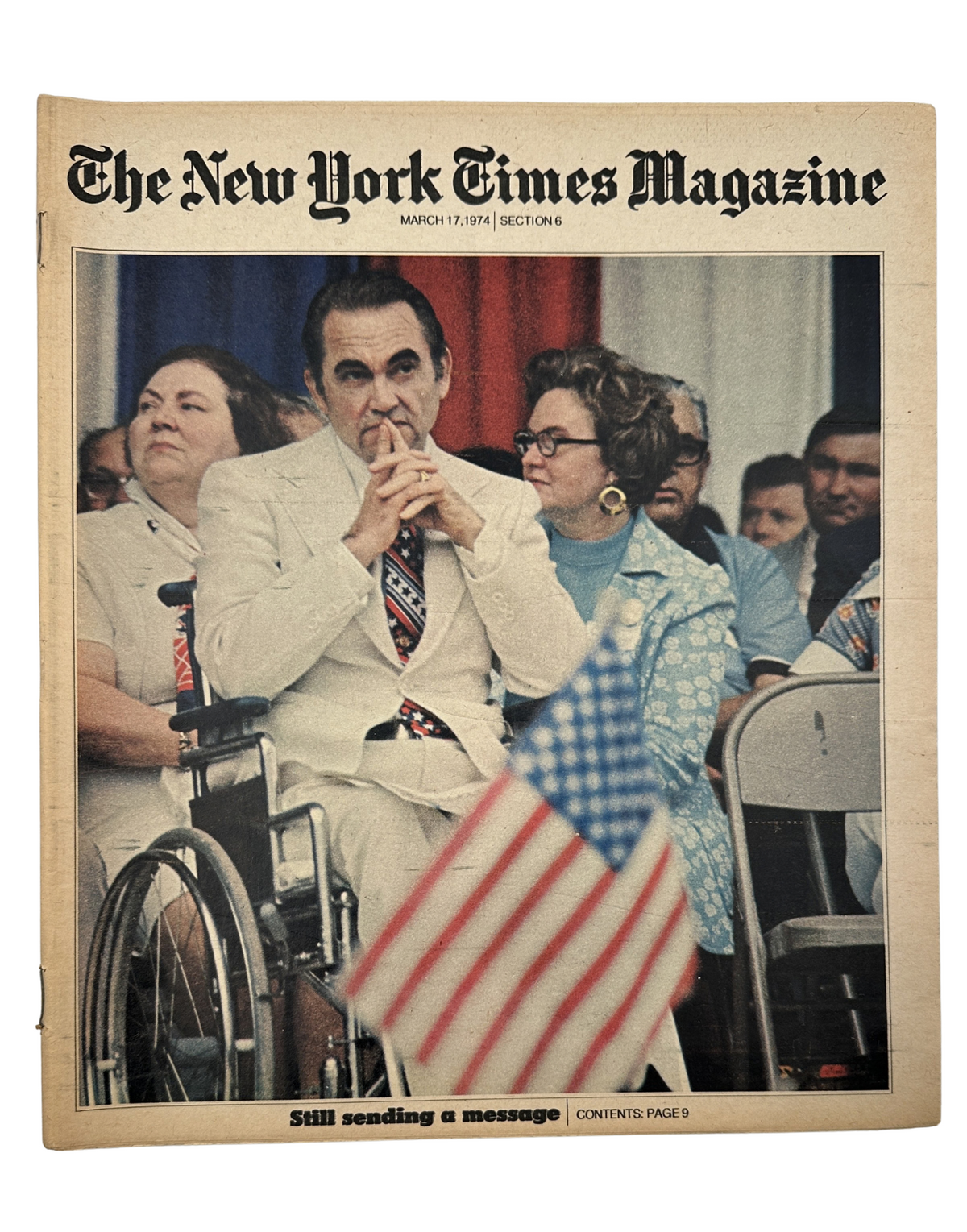 The New York Times Magazine March 17, 1974 cover featuring George Wallace in a wheelchair with an American flag. The image captures a significant moment in history, showcasing the magazine's notable content.