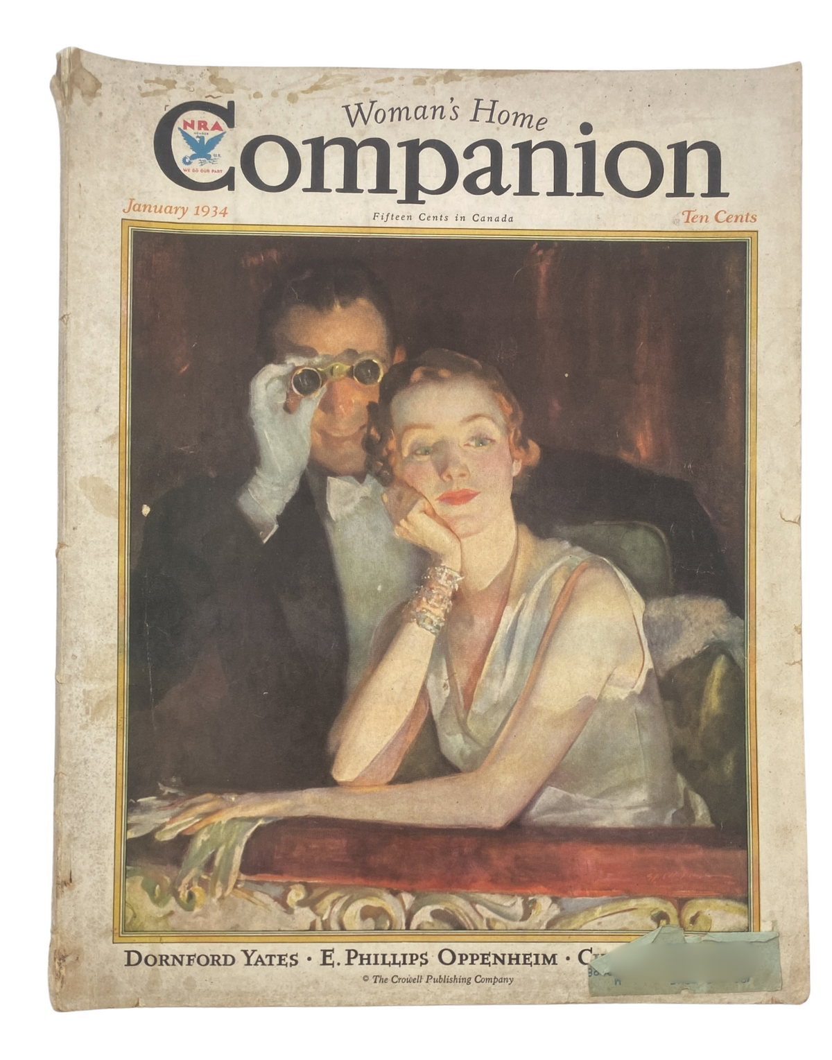 Cover of Woman's Home Companion Magazine January 1934 featuring artwork of a woman and man, along with the names Dornford Yates and E. Phillips Oppenheim.