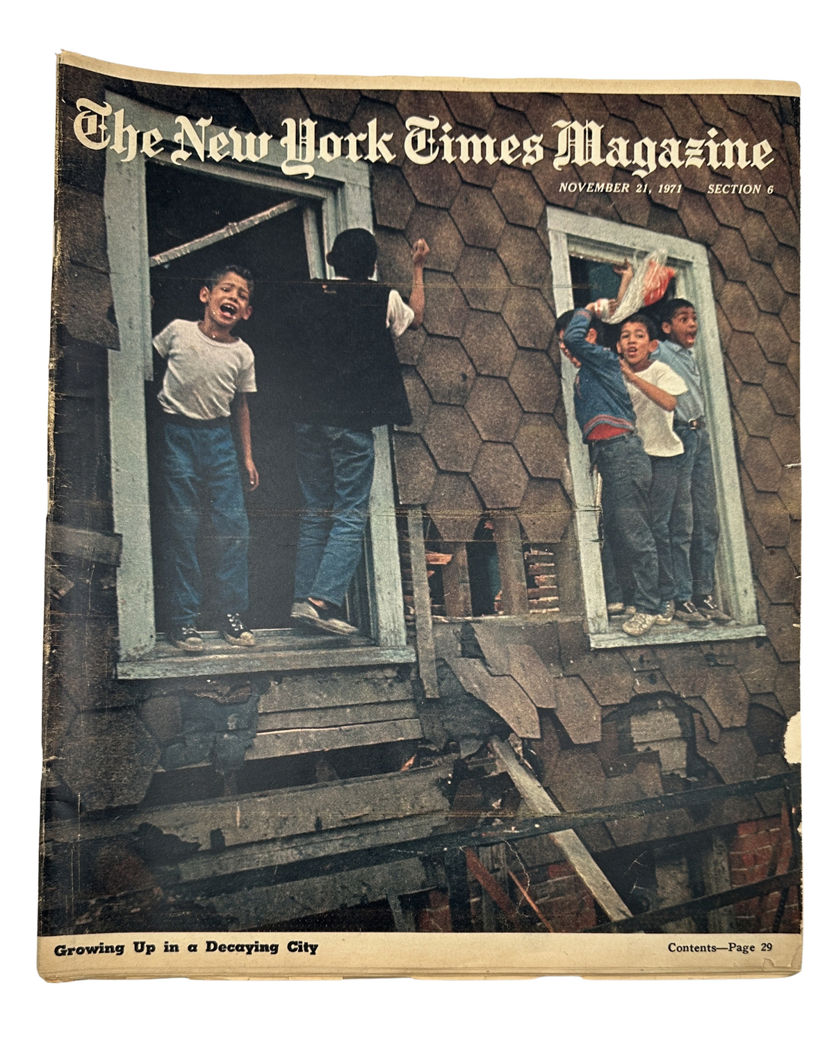 The New York Times Magazine cover from November 21, 1971, featuring children playing in windows of an abandoned building, symbolizing urban decay in New York City.