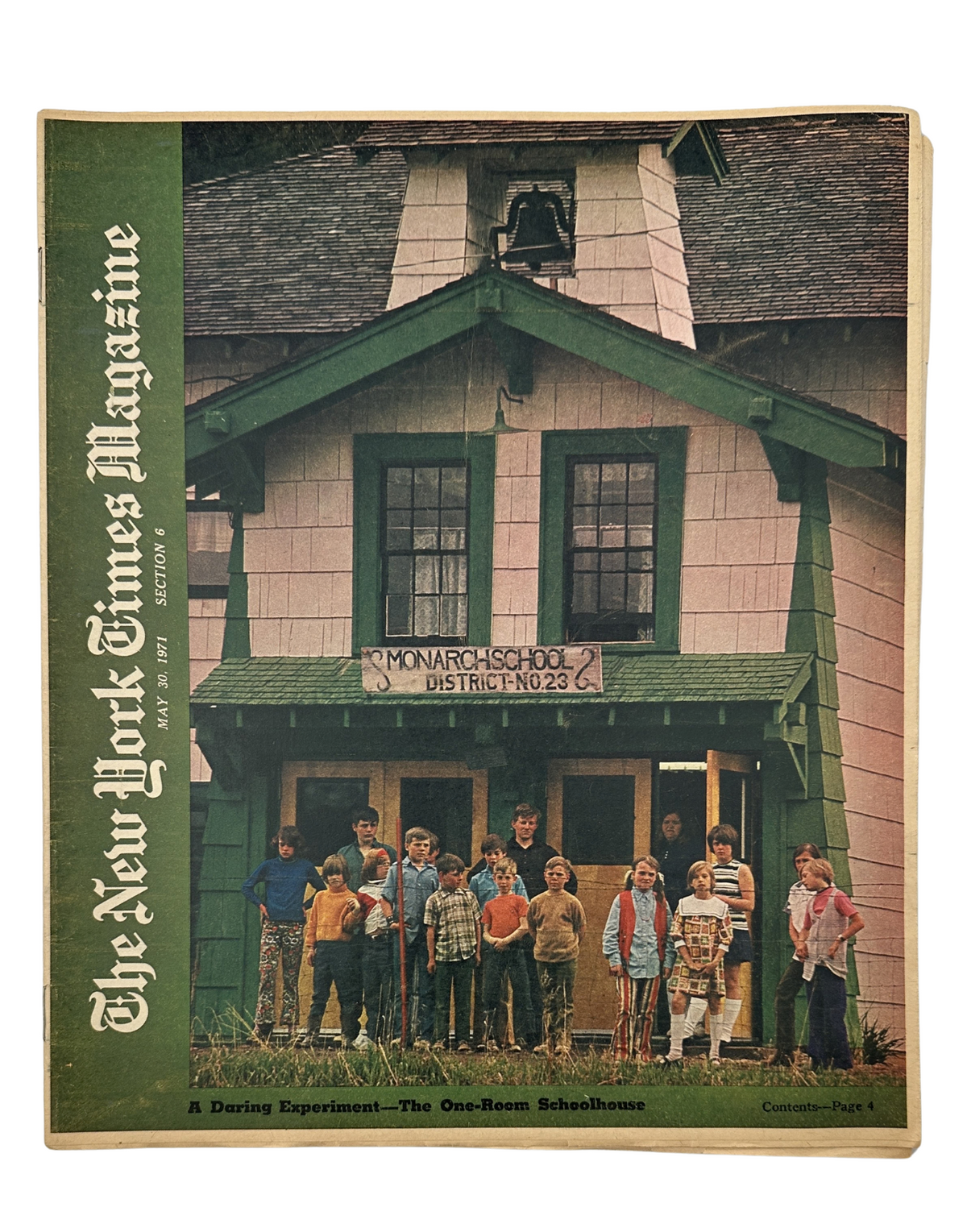 Cover of The New York Times Magazine dated May 30, 1971, featuring a one-room schoolhouse with students posing outside, representing educational themes.